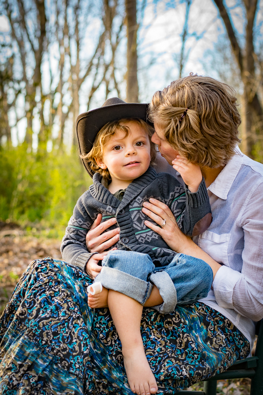 Portrait of a mother whispering to her son at Baker Creek Preserve.