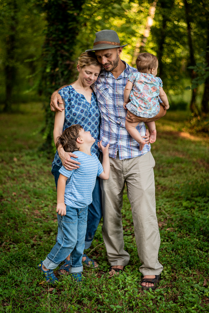 Portrait of a mother, father, and two children at Baker Creek Preserve in Knoxville, TN.