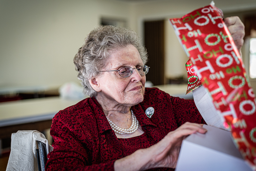 Portraits of my grandmother opening a Christmas gift.