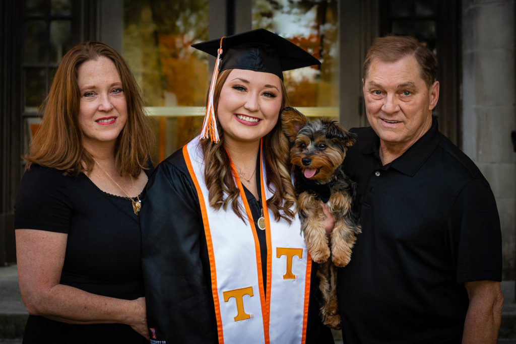 A UTK student at Morgan Hall with her parents and dog.