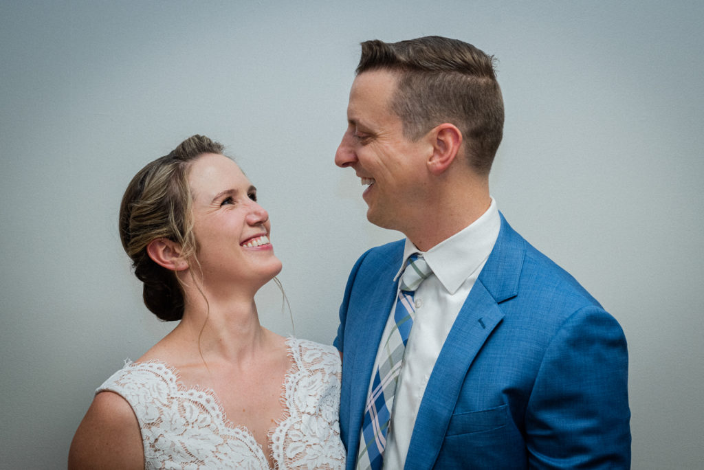 A bride and groom smile at each other at their wedding at the Knox County Courthouse in downtown Knoxville.