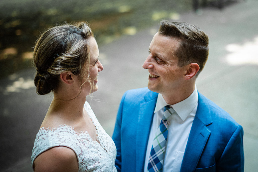A bride and groom smile at each other after their wedding at the Knox County Courthouse in downtown Knoxville.