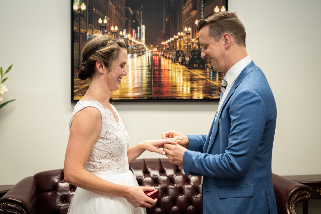 A bride and groom exchange rings at their wedding at the Knox County Courthouse in downtown Knoxville.