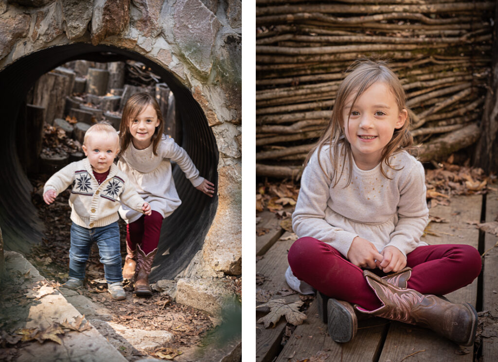 A young girl and her baby brother play on a forest playground.