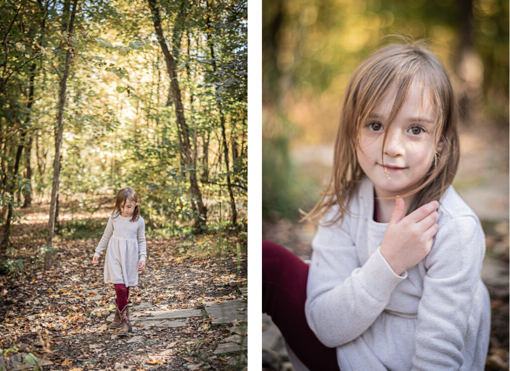 A young girl plays in the woods by herself.